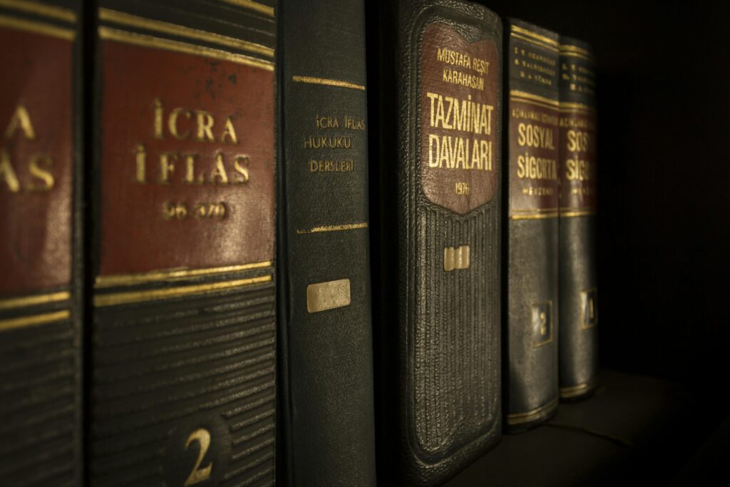 justice-law-case-hearing-159832-159832 Detailed close-up of law and regulation books on a bookshelf, emphasizing education and knowledge.